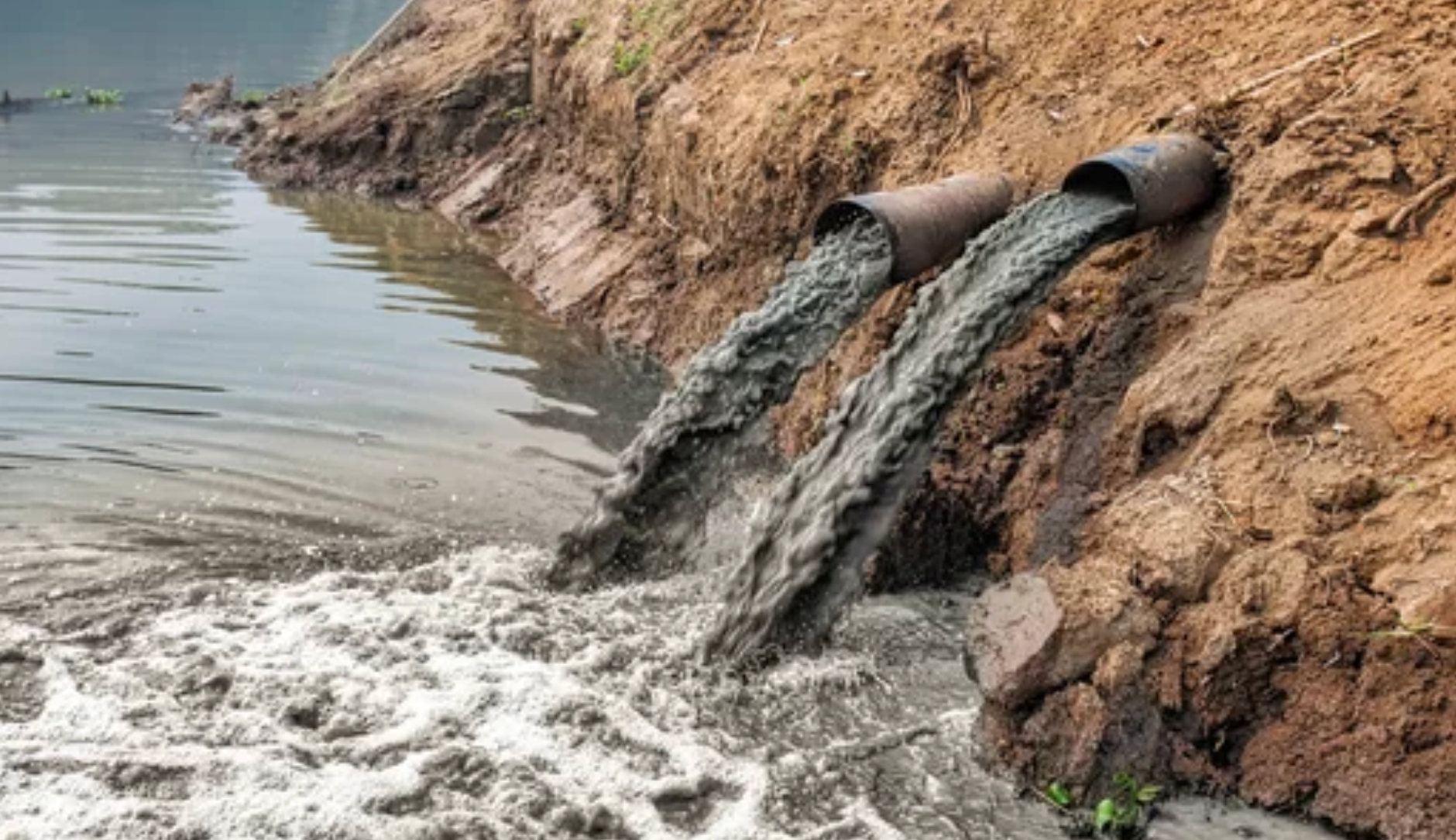 Contamination pouring into fresh water source, contaminated water, insudstrial dumping.